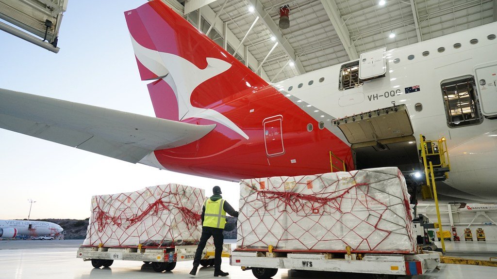 Nearly 100,000 N95 respirator masks are loaded onto a Qantas plane in Los Angeles on Jan. 6, 2020, bound for wildfire-impacted areas of Australia. Direct Relief maintains the largest private inventory of N95 masks in California, and is coordinating with Australian agencies and organization to distribute the masks where they're needed most. Qantas shipped the masks free-of-charge. (Lara Cooper/Direct Relief)