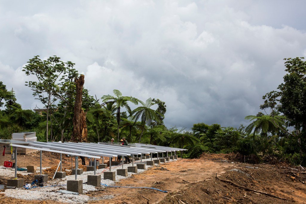 Tuesday November 6, 2018 / Yabucoa, Puerto Rico/Alex Rodriguez, a young PHD candidate from Canovanas Puerto Rico, works at the Tejas community in Yabucoa, installing solar panels to provide power to the community water pump system. Direct Relief is committed to provide clean water to non-PRASA communities in the Island. After Hurricane Maria. Photo: Dennis M. Rivera Pichardo for Direct Relief
