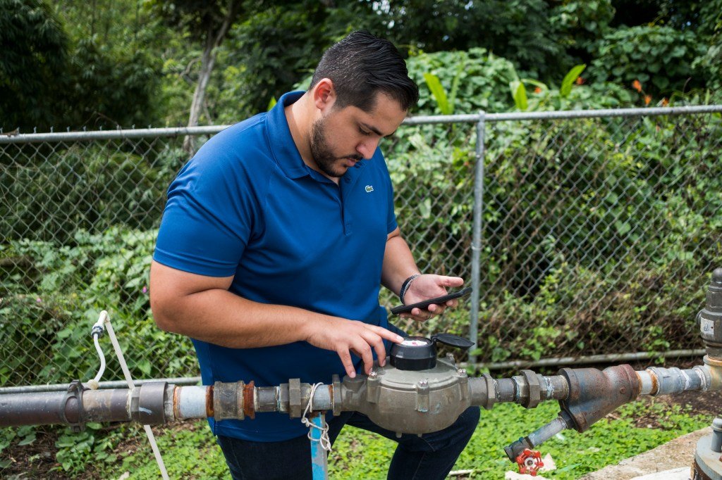 Tuesday November 6, 2018 / Yabucoa, Puerto Rico/Alex Rodriguez, a young PHD candidate from Canovanas Puerto Rico, works at the Tejas community in Yabucoa, installing solar panels to provide power to the community water pump system. Direct Relief is committed to provide clean water to non-PRASA communities in the Island. After Hurricane Maria. Photo: Dennis M. Rivera Pichardo for Direct Relief