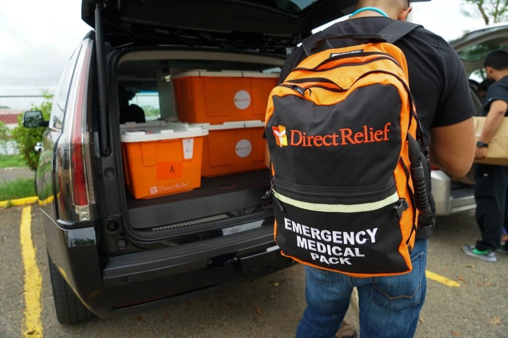 Doctors unload medicines for temporary pharmacy set up in a school library to serve patients in the hard-hit community of Coamo. (Lara Cooper/Direct Relief)